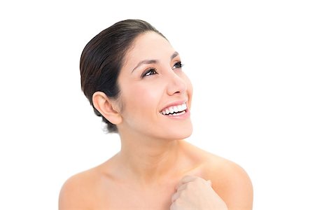 simsearch:400-06960125,k - Smiling brunette looking up on white background Photographie de stock - Aubaine LD & Abonnement, Code: 400-06957942