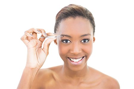 simsearch:400-06960125,k - Smiling natural beauty using tweezers on white background Photographie de stock - Aubaine LD & Abonnement, Code: 400-06958898