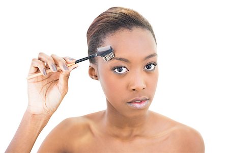 simsearch:400-06960125,k - Natural beauty using eyebrow brush on white background Photographie de stock - Aubaine LD & Abonnement, Code: 400-06958893