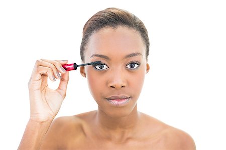 simsearch:400-06960125,k - Natural beauty applying mascara while posing on white background Photographie de stock - Aubaine LD & Abonnement, Code: 400-06958901
