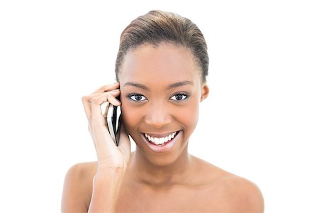 simsearch:400-06960125,k - Smiling natural beauty phoning on white background Photographie de stock - Aubaine LD & Abonnement, Code: 400-06958914