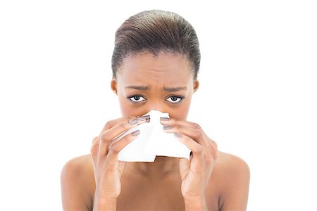 simsearch:400-06960125,k - Worried natural beauty blowing her nose on white background Photographie de stock - Aubaine LD & Abonnement, Code: 400-06958935