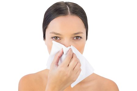 skin disease - Gorgeous woman blowing her nose on white background Stock Photo - Budget Royalty-Free & Subscription, Code: 400-06959025