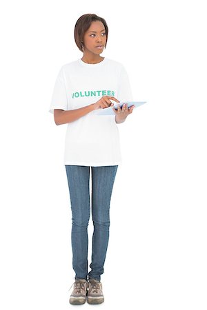 Peaceful volunteer woman using tablet pc on white background Stockbilder - Microstock & Abonnement, Bildnummer: 400-06959154