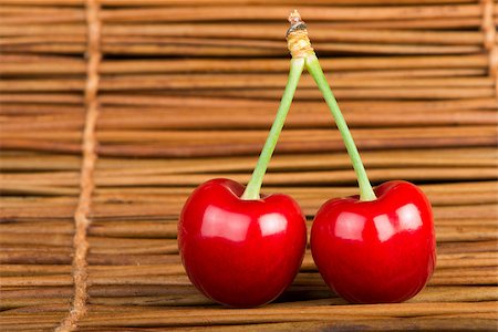 simsearch:400-08110532,k - Two Cherries on wooden background. Studio shot Stock Photo - Budget Royalty-Free & Subscription, Code: 400-06950364