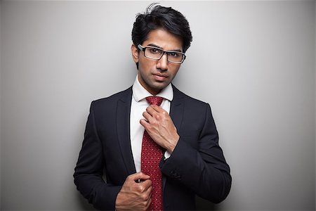 Confident Asian businessman getting ready Stock Photo - Budget Royalty-Free & Subscription, Code: 400-06950603