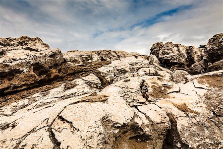 Cracked Cliffs on Rocky Beach in Cascais near Lisbon, Portugal Foto de stock - Super Valor sin royalties y Suscripción, Código: 400-06950653