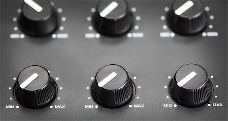 synthesizer - volume knobs with calibration on plastic plate, closeup Stock Photo - Budget Royalty-Free & Subscription, Code: 400-06950840