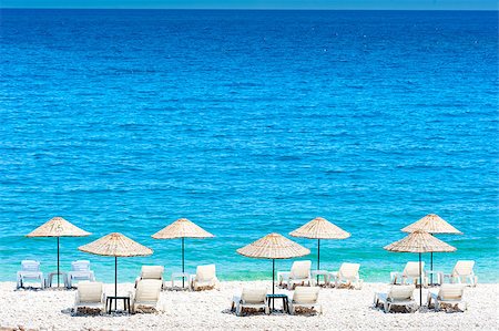 simsearch:400-06947087,k - wicker beach umbrellas on the beach Stock Photo - Budget Royalty-Free & Subscription, Code: 400-06950895