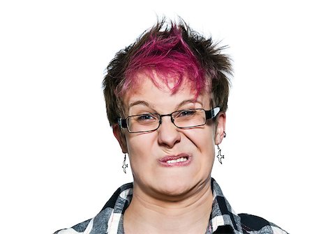 Close-up portrait of young expressive irritated woman making a face in studio on white isolated background Foto de stock - Super Valor sin royalties y Suscripción, Código: 400-06950972