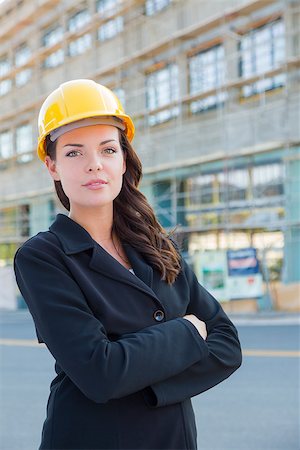 Portrait of Young Attractive Professional Female Contractor Wearing Hard Hat at Construction Site. Stock Photo - Budget Royalty-Free & Subscription, Code: 400-06951137
