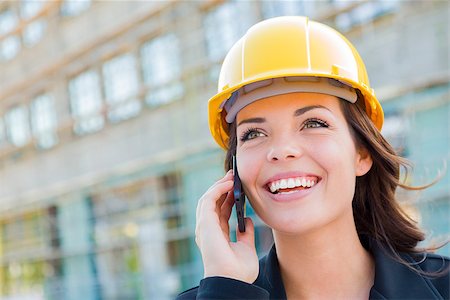 Young Professional Female Contractor Wearing Hard Hat at Contruction Site Using Cell Phone. Stock Photo - Budget Royalty-Free & Subscription, Code: 400-06951133