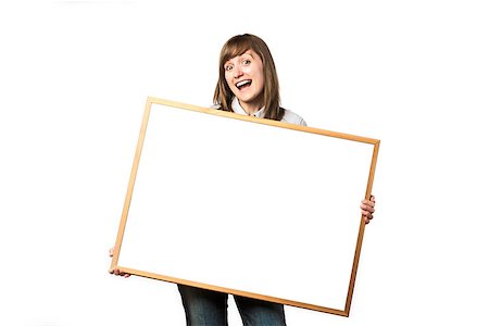 Happy young girl is holding a blank whiteboard Stock Photo - Budget Royalty-Free & Subscription, Code: 400-06951196
