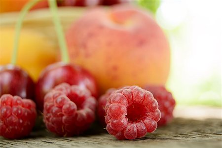 simsearch:400-07667203,k - Fresh Ripe Sweet Fruits on the Wooden Table in the Garden. Fresh Organic Food Stock Photo - Budget Royalty-Free & Subscription, Code: 400-06951427