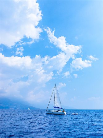 sailboat racing - Sail yacht in the sea, summer holidays, sailing sport, water transport, luxury lifestyle, peaceful landscape, travel and vacation concept Stock Photo - Budget Royalty-Free & Subscription, Code: 400-06951828