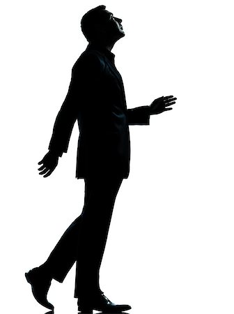 simsearch:400-06794896,k - one caucasian business man walking looking up silhouette Full length in studio isolated on white background Stock Photo - Budget Royalty-Free & Subscription, Code: 400-06951907
