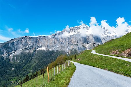 Asphalt rural road on the background of the Bernese Alps Stock Photo - Budget Royalty-Free & Subscription, Code: 400-06952186