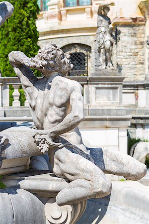 peles castle - Allegoric stone male statue of a fountain in Peles castle garden, Sinaia, Romania. Peles castle is the most visited museum in Romania with more than 300.000 tourists every year. Stock Photo - Budget Royalty-Free & Subscription, Code: 400-06952382