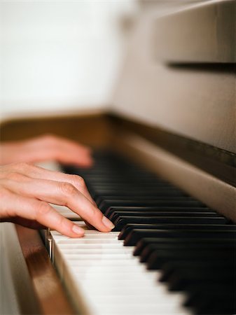 piano practice - Photo of female hands playing an upright piano. Very shallow depth of field with focus on fingers. Stock Photo - Budget Royalty-Free & Subscription, Code: 400-06952524