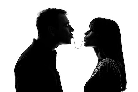 simsearch:400-07097695,k - one caucasian couple man and woman eating the same spaghetti in studio silhouette isolated on white background Stock Photo - Budget Royalty-Free & Subscription, Code: 400-06952607