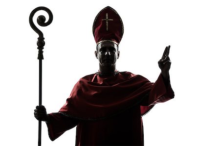 priest blessing - one man cardinal bishop silhouette saluting blessing in studio isolated on white background Stock Photo - Budget Royalty-Free & Subscription, Code: 400-06952678