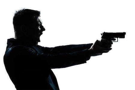 simsearch:400-07097770,k - one caucasian spy criminal policeman detective man holding gun portrait silhouette in studio isolated white background Photographie de stock - Aubaine LD & Abonnement, Code: 400-06952685