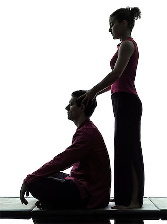 full body massage - one man and woman performing thai massage in silhouette studio on white background Foto de stock - Super Valor sin royalties y Suscripción, Código: 400-06953358
