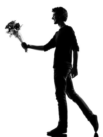 simsearch:400-07097695,k - young man offering flowers bouquet silhouette in studio isolated on white background Stock Photo - Budget Royalty-Free & Subscription, Code: 400-06953433