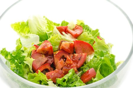 simsearch:400-06954534,k - Tasty salad with tomatoes and green lettuce in a glass bowl. Stock Photo - Budget Royalty-Free & Subscription, Code: 400-06953479