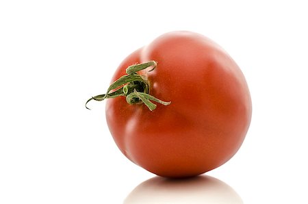 simsearch:400-06954534,k - Single shiny tomato isolated on a white background. Stock Photo - Budget Royalty-Free & Subscription, Code: 400-06953490