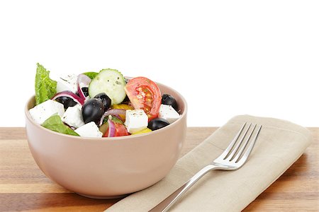 fresh greek salad in clay bowl, on table Stock Photo - Budget Royalty-Free & Subscription, Code: 400-06953600