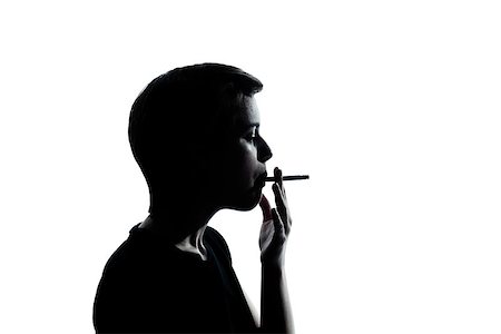 smoking teen boys - one caucasian young teenager silhouette boy or girl portrait in studio cut out isolated on white background Stock Photo - Budget Royalty-Free & Subscription, Code: 400-06953893