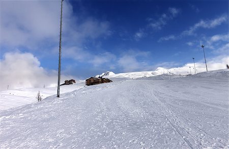 simsearch:400-08780271,k - Ski slope and hotels in winter mountains. Georgia, ski resort Gudauri. Caucasus Mountains. Wide-angle view. Photographie de stock - Aubaine LD & Abonnement, Code: 400-06953935