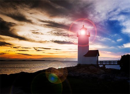 simsearch:400-04813407,k - Annisquam lighthouse at sunset off the coast of Gloucester, MA. USA Photographie de stock - Aubaine LD & Abonnement, Code: 400-06953957