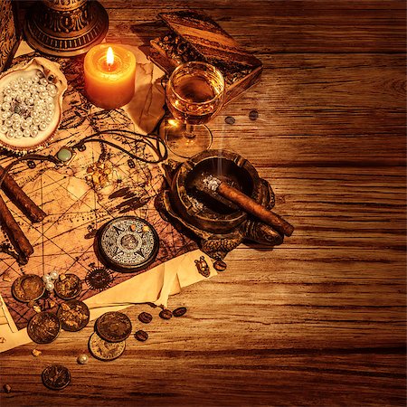 Pirates treasure border, glass with wine and cigars for filibuster, map with way to treasures island, golden coins, antique accessories, crime and piracy concept Stock Photo - Budget Royalty-Free & Subscription, Code: 400-06953988