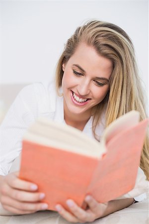 simsearch:693-07542343,k - Gorgeous model lying on cosy bed in bright bedroom reading book Stock Photo - Budget Royalty-Free & Subscription, Code: 400-06960004