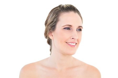 simsearch:400-06960125,k - Smiling woman looking away against white background Photographie de stock - Aubaine LD & Abonnement, Code: 400-06960059
