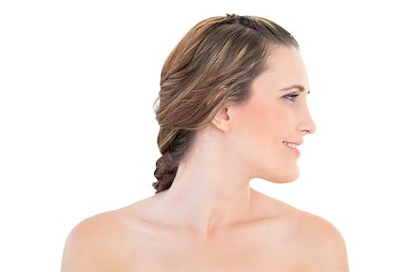 simsearch:400-06960125,k - Side view of smiling woman against white background Photographie de stock - Aubaine LD & Abonnement, Code: 400-06960051