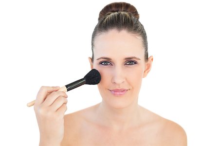 simsearch:400-06960125,k - Happy woman using blusher brush on white background Photographie de stock - Aubaine LD & Abonnement, Code: 400-06960097