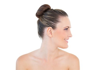 simsearch:400-06960125,k - Smiling woman looking aside against white background Photographie de stock - Aubaine LD & Abonnement, Code: 400-06960093