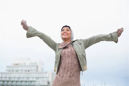 simsearch:400-08430017,k - Enjoying young model in winter clothes having fun outside on a cloudy day Stock Photo - Budget Royalty-Free & Subscription, Code: 400-06960927