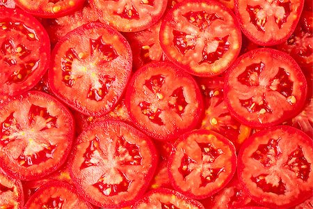 Tomatoes slices. Healthy organic food, background. Photographie de stock - Aubaine LD & Abonnement, Code: 400-07036236