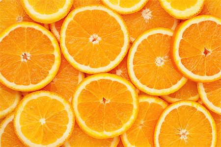 Ripe orange slices. Healthy food, background. Photographie de stock - Aubaine LD & Abonnement, Code: 400-07036233