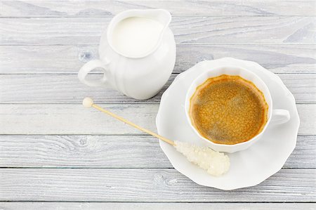 black coffee and milk jug on a wooden table Stock Photo - Budget Royalty-Free & Subscription, Code: 400-07036365