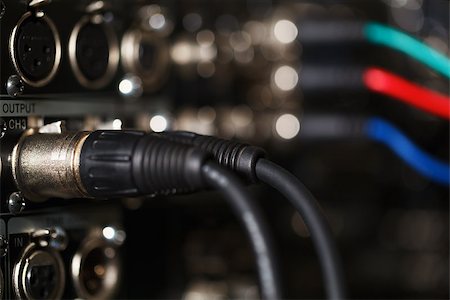 XLR audio digital cables in the rear panel of the professional VCR. RGB video cables in blur. Stock Photo - Budget Royalty-Free & Subscription, Code: 400-07036441