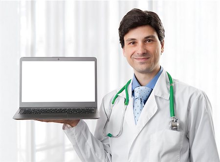 doctor business computer - doctor holding a laptop computer with blank screen, isolated on a white background. Stock Photo - Budget Royalty-Free & Subscription, Code: 400-07036917