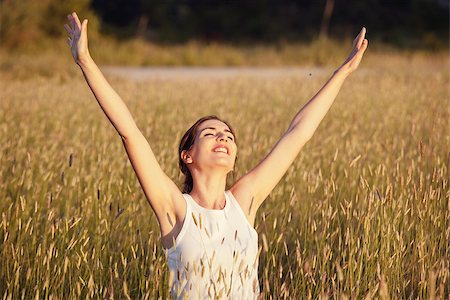 Outdoor portrait of a woman on a meadow releaxing Stock Photo - Budget Royalty-Free & Subscription, Code: 400-07037110