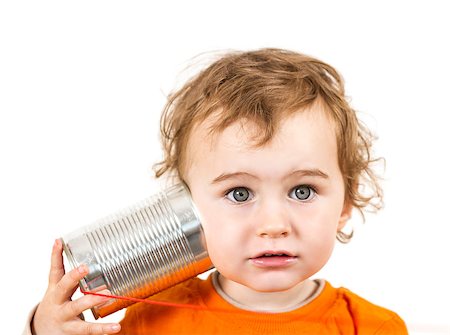 young caucasian child with tin can phone looking to camera Photographie de stock - Aubaine LD & Abonnement, Code: 400-07038459
