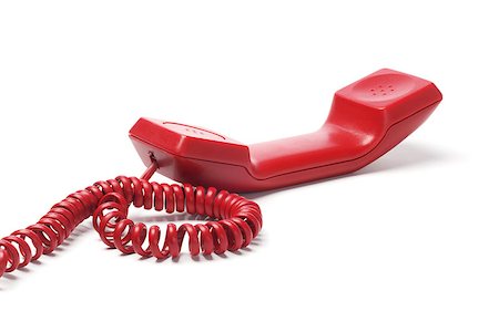 simsearch:400-07038627,k - Red Telephone Handset Lying On White Background Photographie de stock - Aubaine LD & Abonnement, Code: 400-07038627