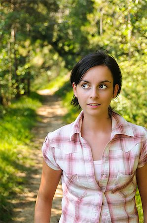 simsearch:400-05716719,k - A young Caucasian girl looking surprised wearing mountain clothes on a hiking path in the wood Stock Photo - Budget Royalty-Free & Subscription, Code: 400-07038702